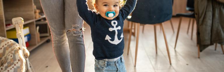 Little boy taking first steps