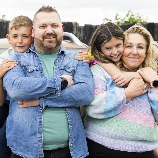 Dad and mum with young son and daughter
