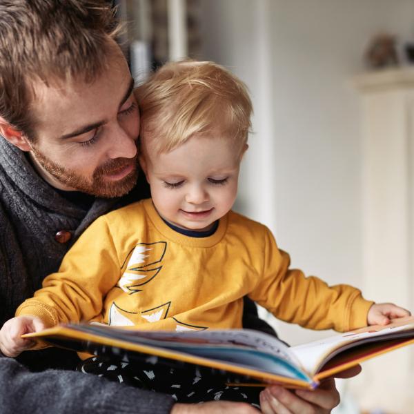 Dad reading with son